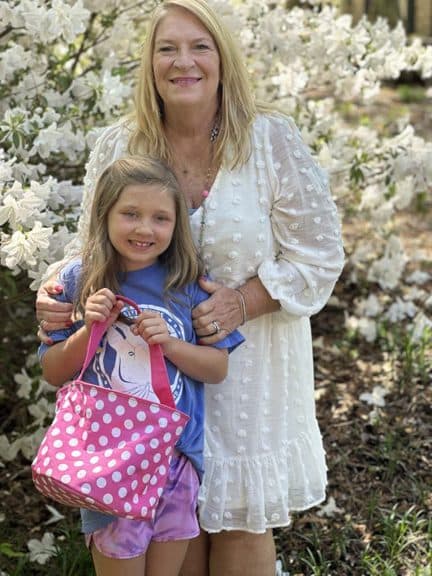 Connie in the garden with a young artist