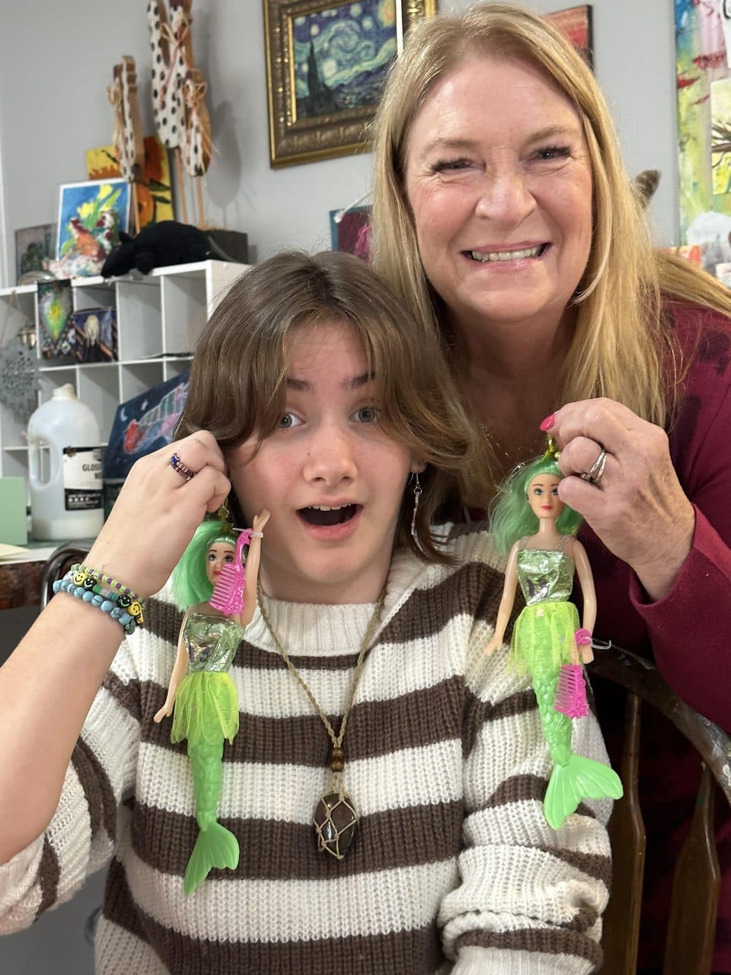 Connie and a student sharing a laugh over a project