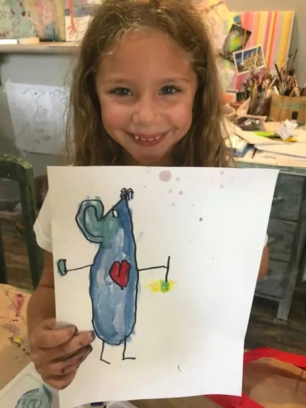 A young artist with her own Art Mouse painting